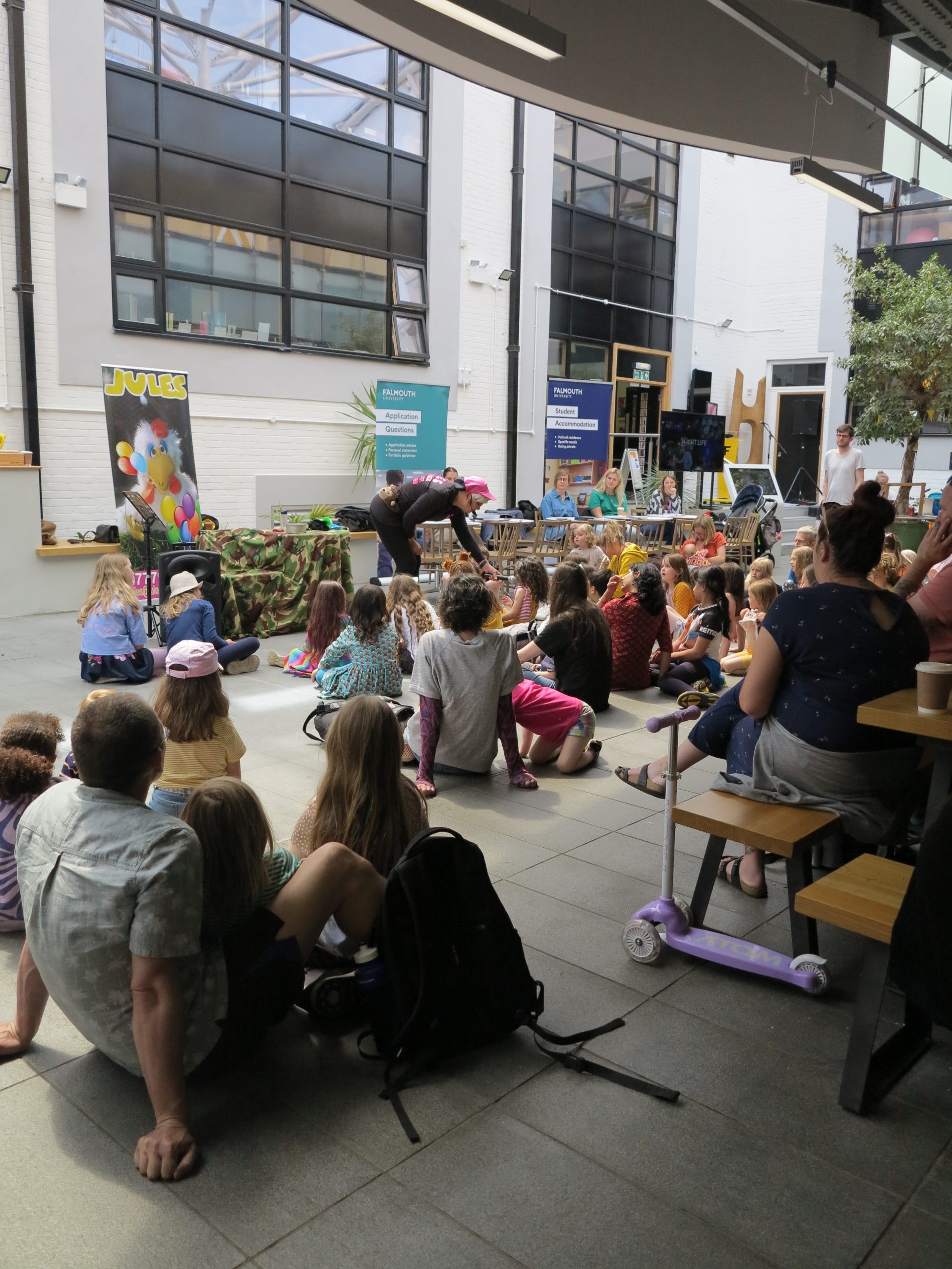 Image of parents and children at a Community Day 22 at Falmouth Campus