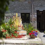 Entrance to chaplaincy at Penryn campus with bench and plants outside