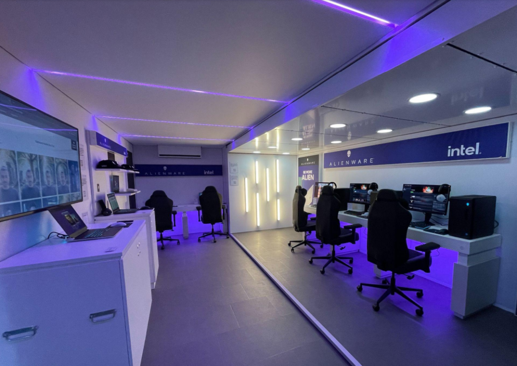 Image of a alienware gaming equipment inside roadshow tour bus with blue neon lights