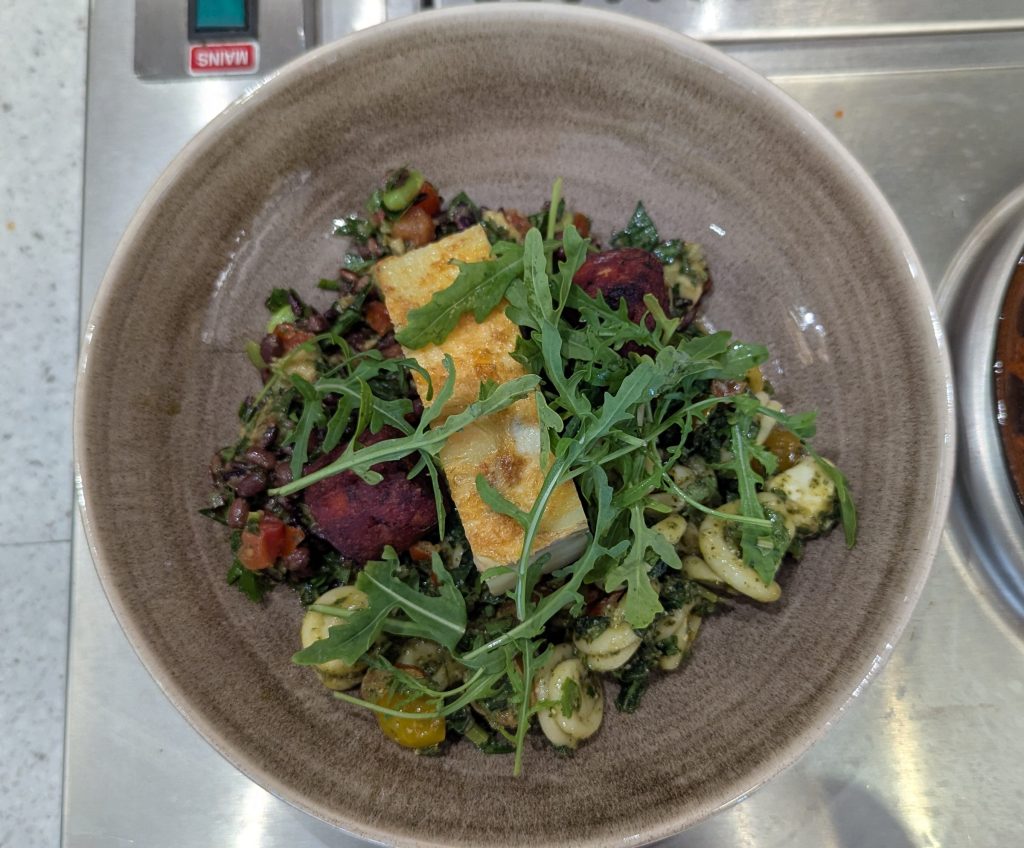 Image of a one of the mains plus beetroot and rocket salad options at the ESI Cafe.